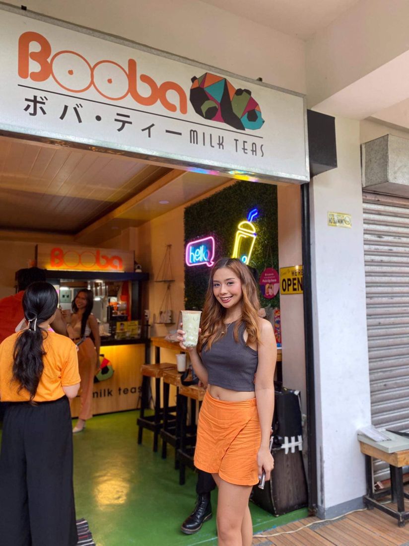 A customer outside a Booba Milk Tea store